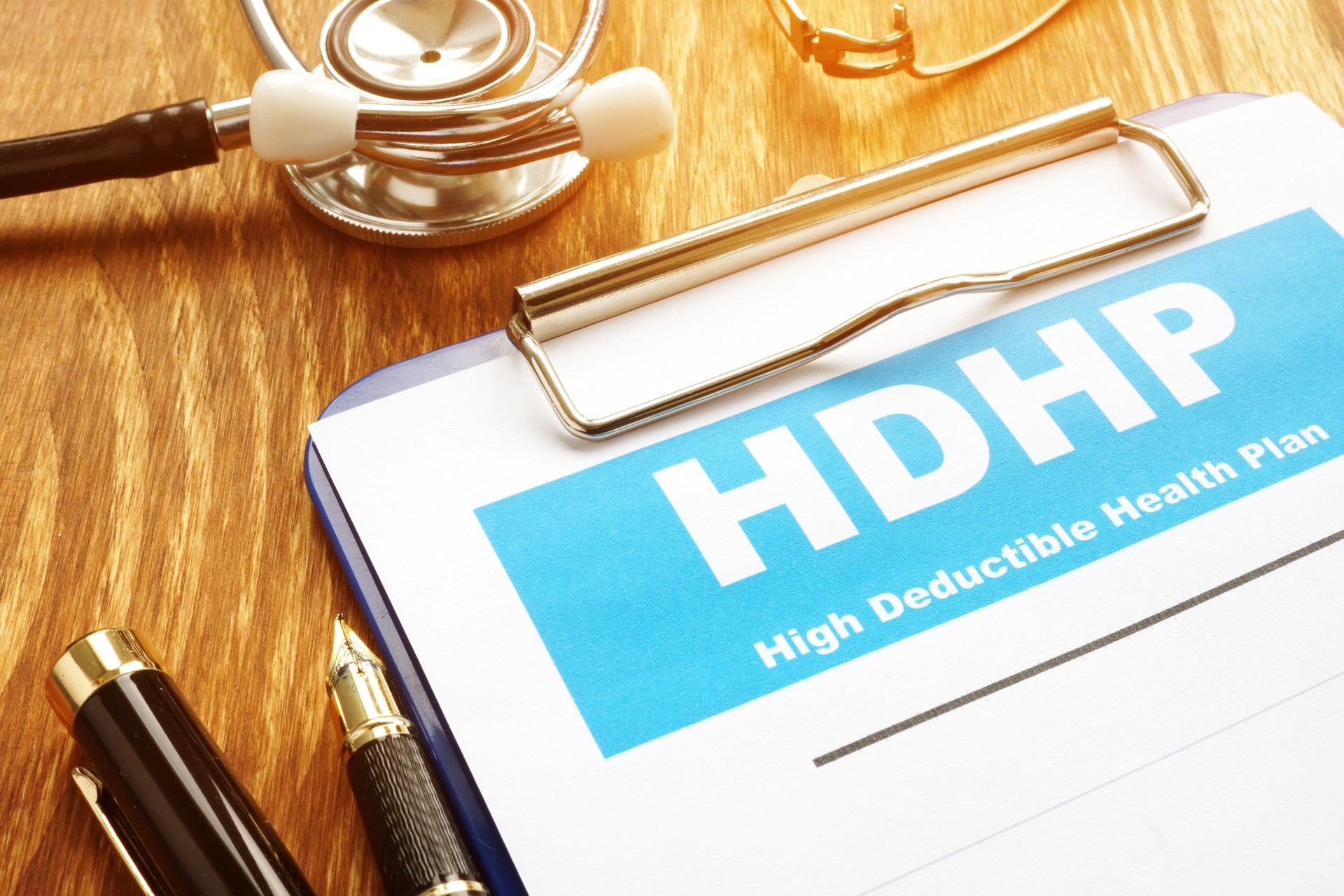 High Deductible Health Plan HDHP with clipboard.